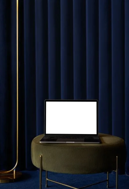 Laptop on a desk showing the Pexels homepage, highlighting its web interface.